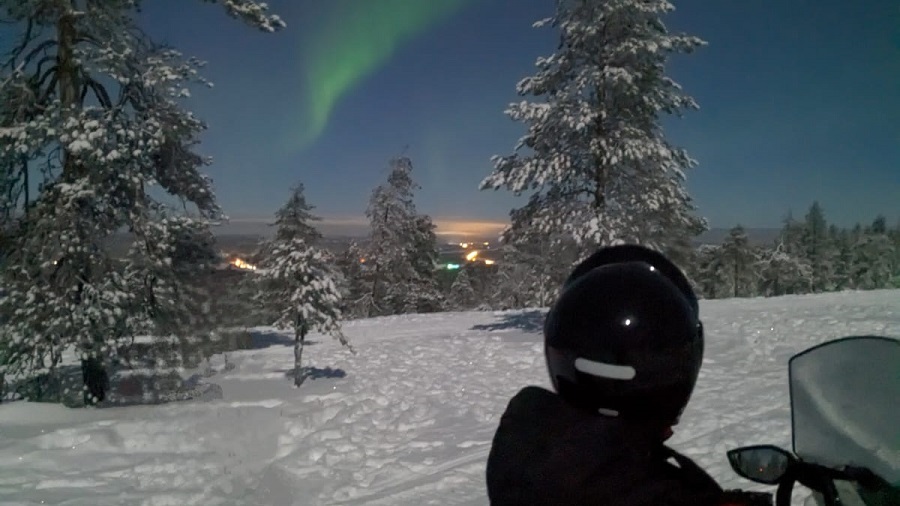 Snowmobile aurora hunting trip